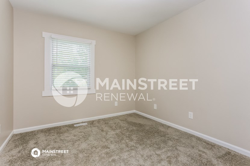 a room with carpet and a window