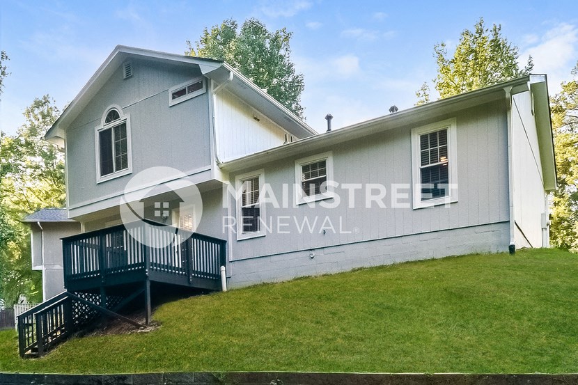 a home with a front porch and a lawn