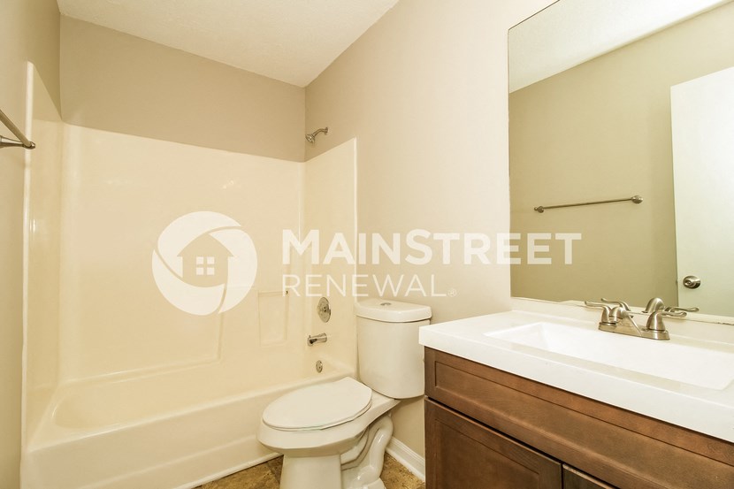 a bathroom with a toilet and a sink