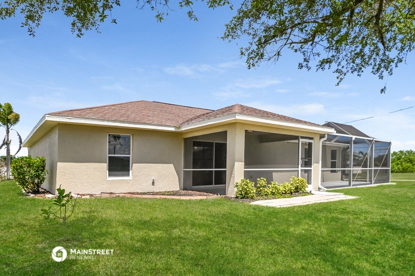 a house with a lawn and a tree