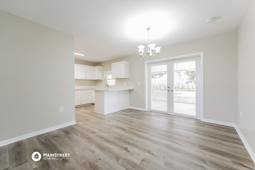 the living room and kitchen of a new home