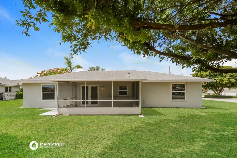 a house with a lawn and a tree