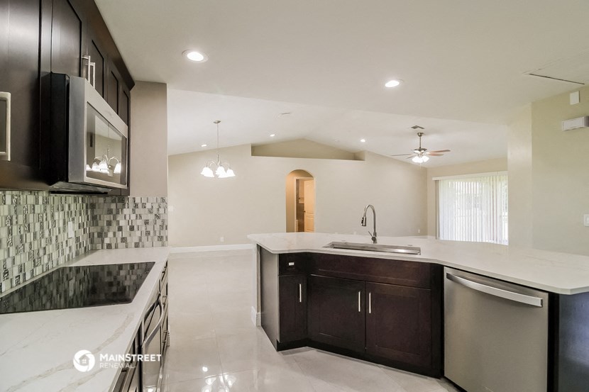 a kitchen with a sink and a counter top
