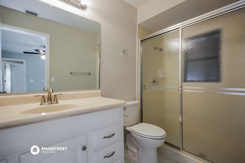 a bathroom with a sink toilet and a shower