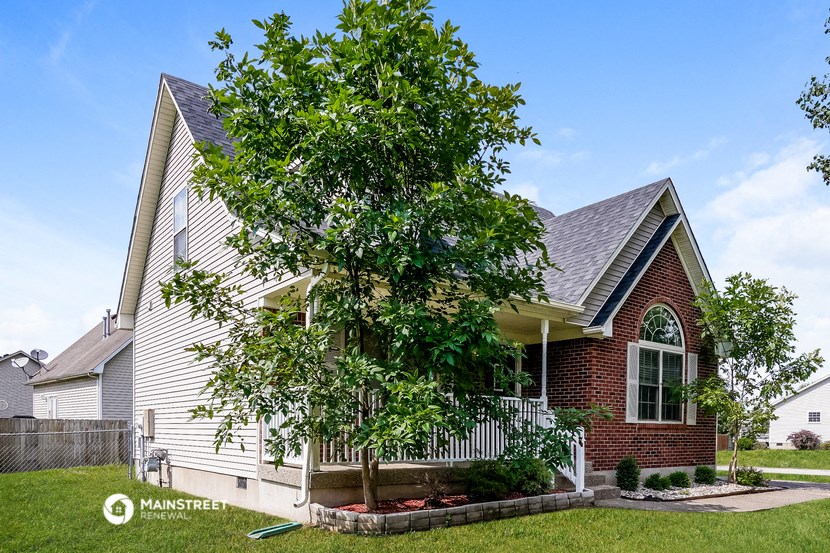 a house with a tree in front of it