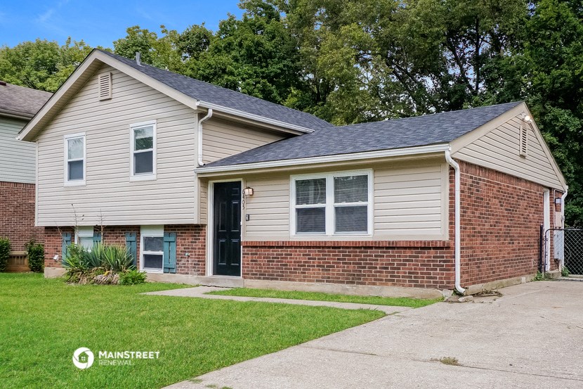 a small brick and with a sidewalk and grass