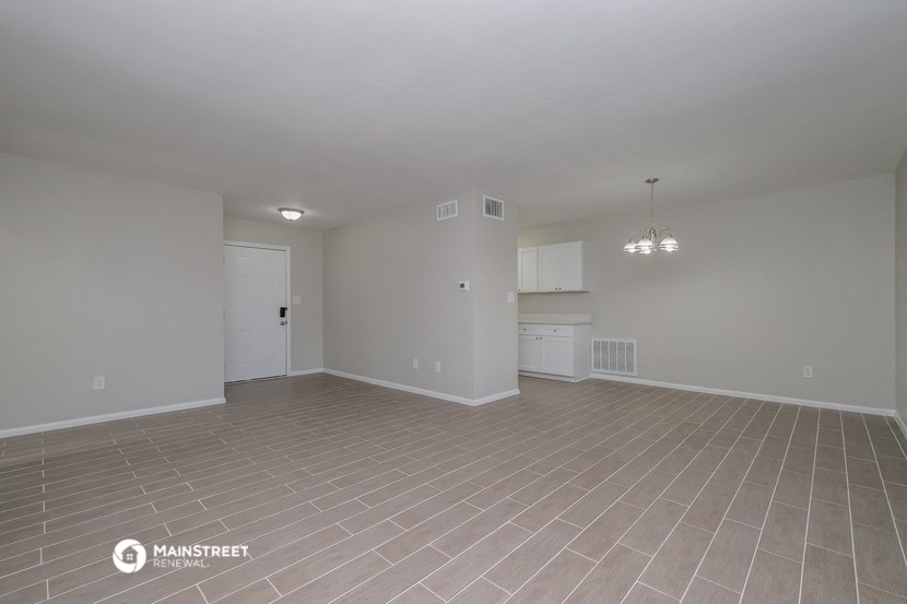 the living room and kitchen of an apartment