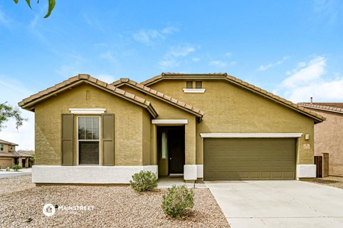 a house with a driveway and a garage door
