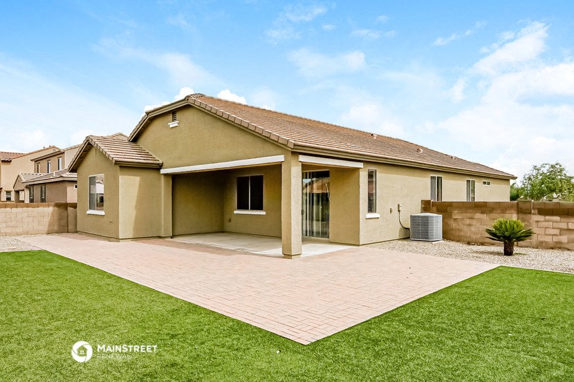 a house with a yard and a green lawn