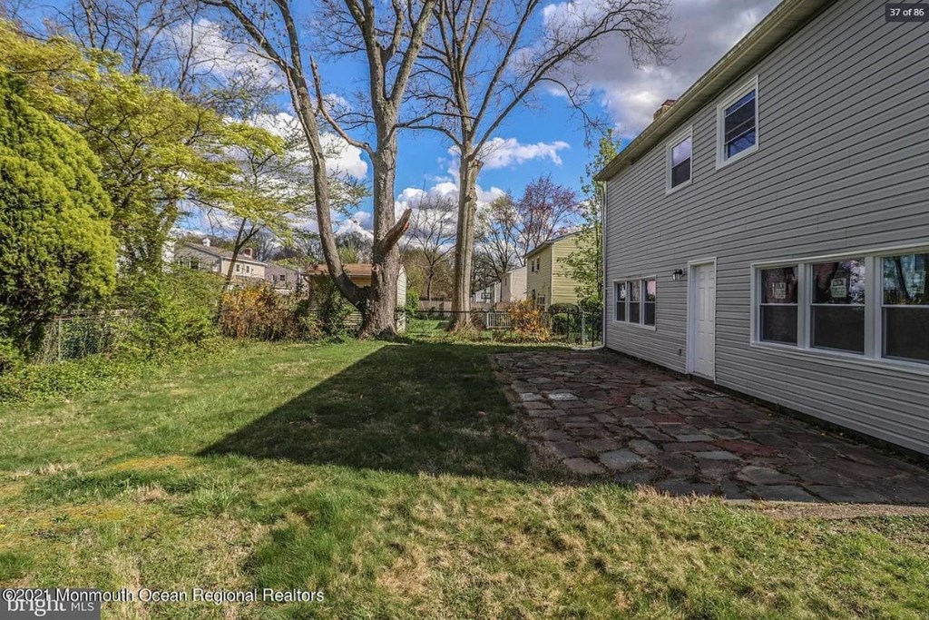 A house with a stone pathway leading to the front door.