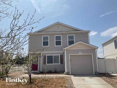 a gray house with a garage door