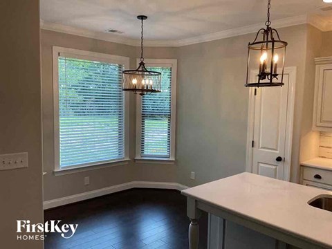 A kitchen with a FirstKey Homes logo.