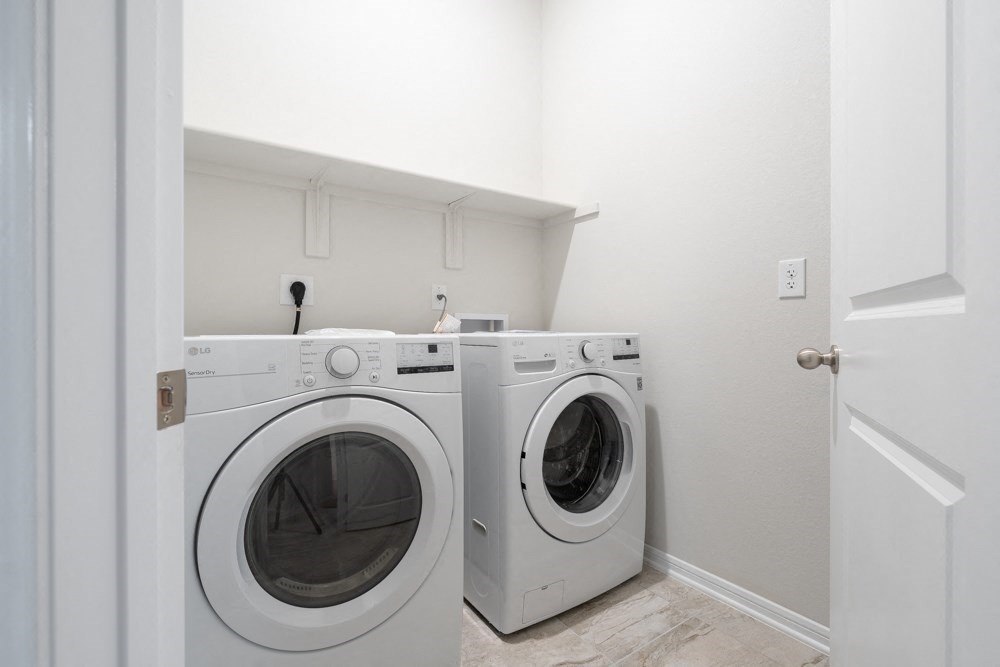 a washer and dryer in a laundry room with a door