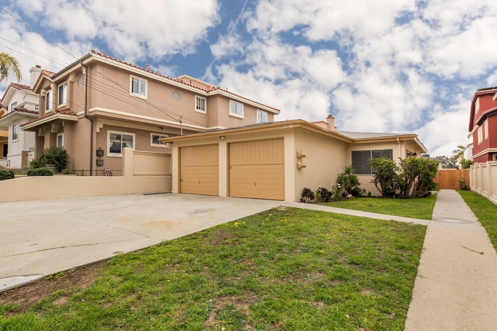 a house with a driveway and a garage door