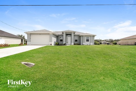 a house with a lawn in front of it