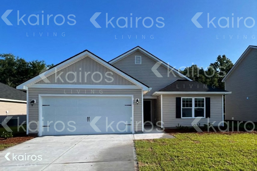 a house with a white garage door and a lawn