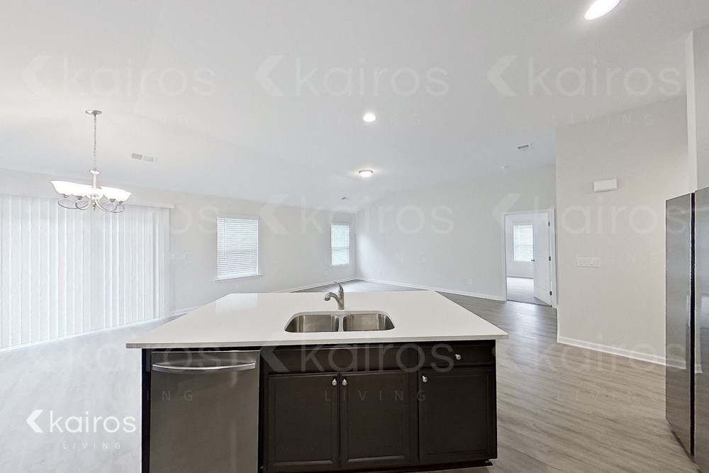 a kitchen with an island in a new home