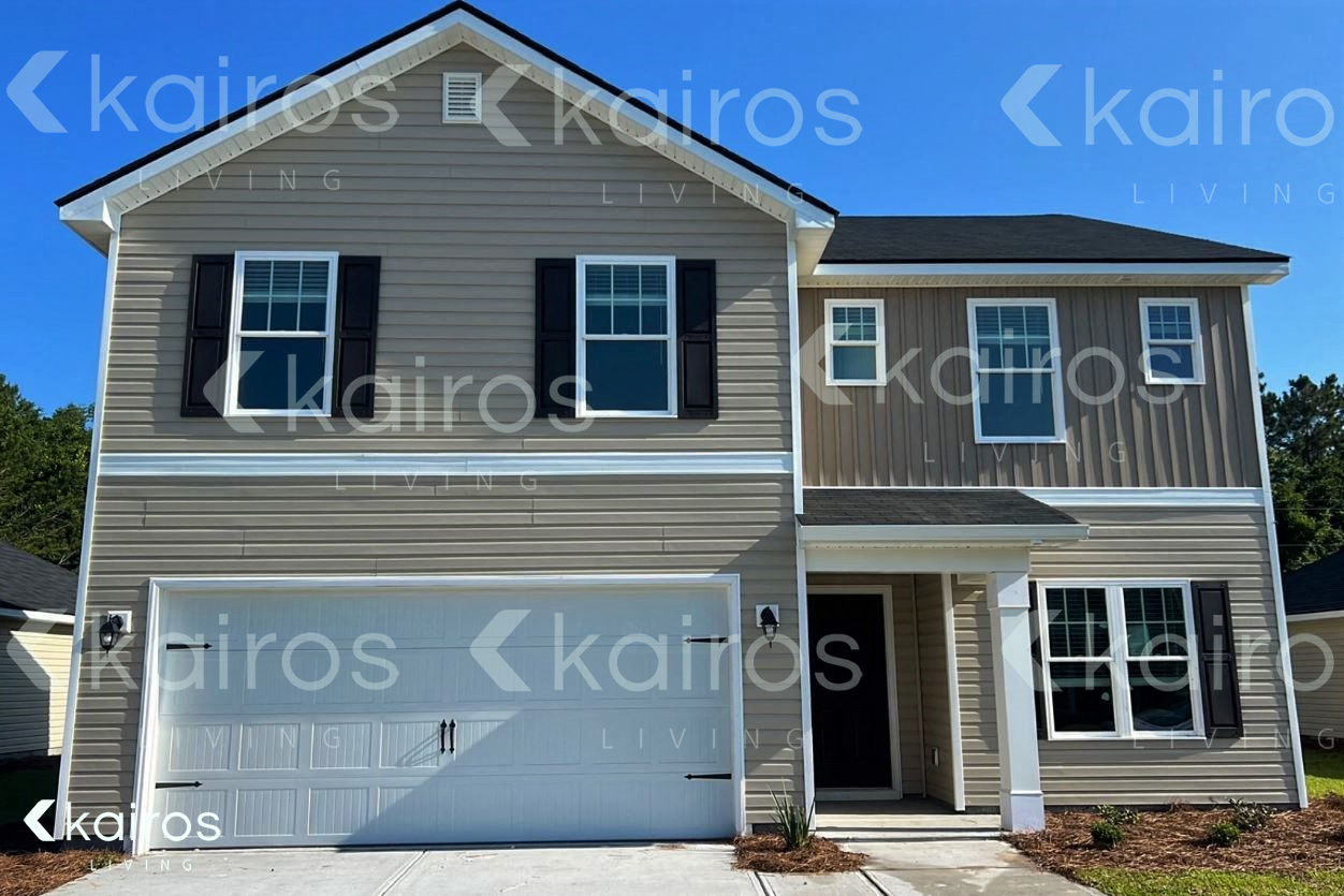 a gray house with a garage door
