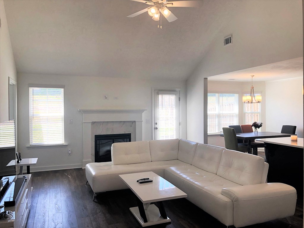 a living room with a white couch and a coffee table