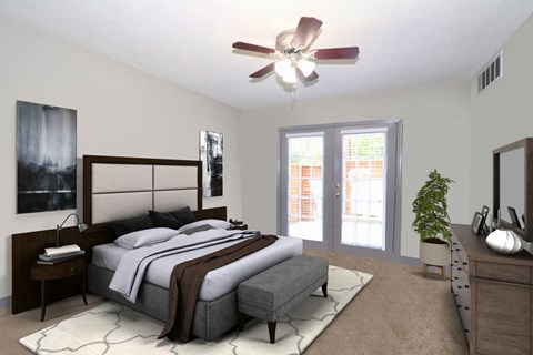a bedroom with a bed and a ceiling fan