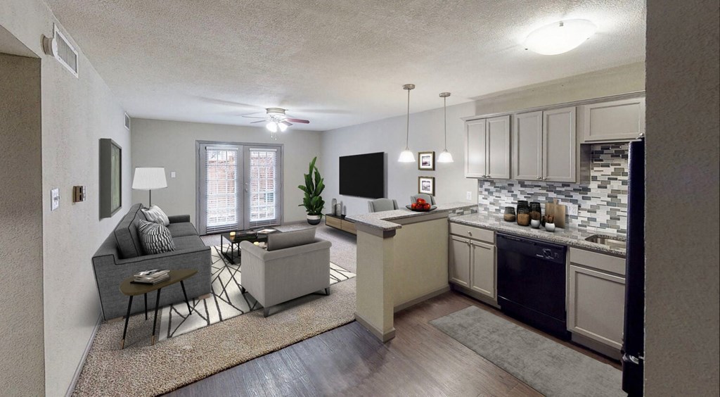 an open living room and kitchen with a couch and a table