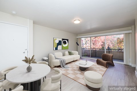A living room with a white couch and a coffee table.