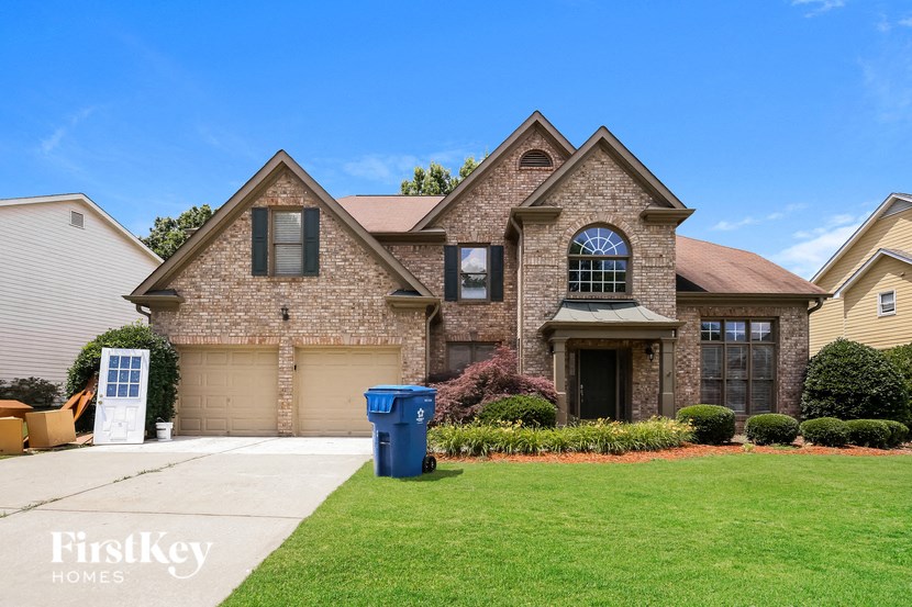a house with a blue mailbox in front of it