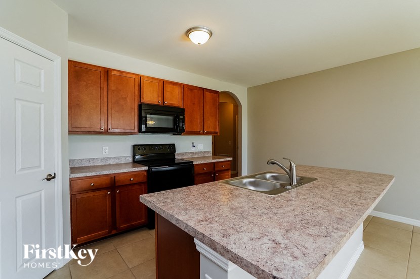 a kitchen with granite counter tops and a sink