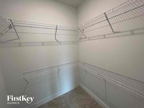 the walk in closet in the master bedroom of this home for sale