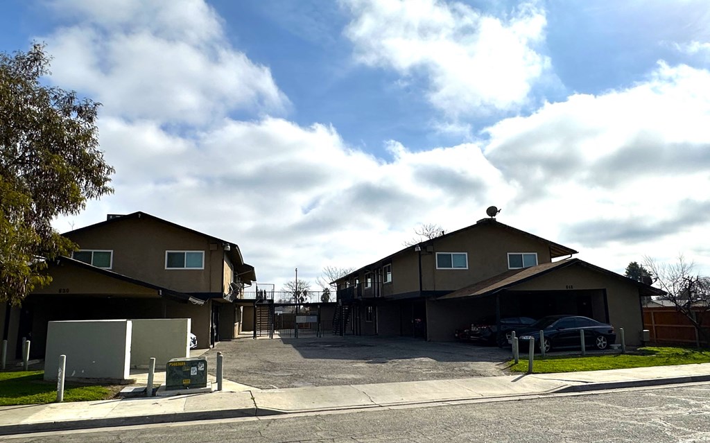 A large house with a driveway in front of it.