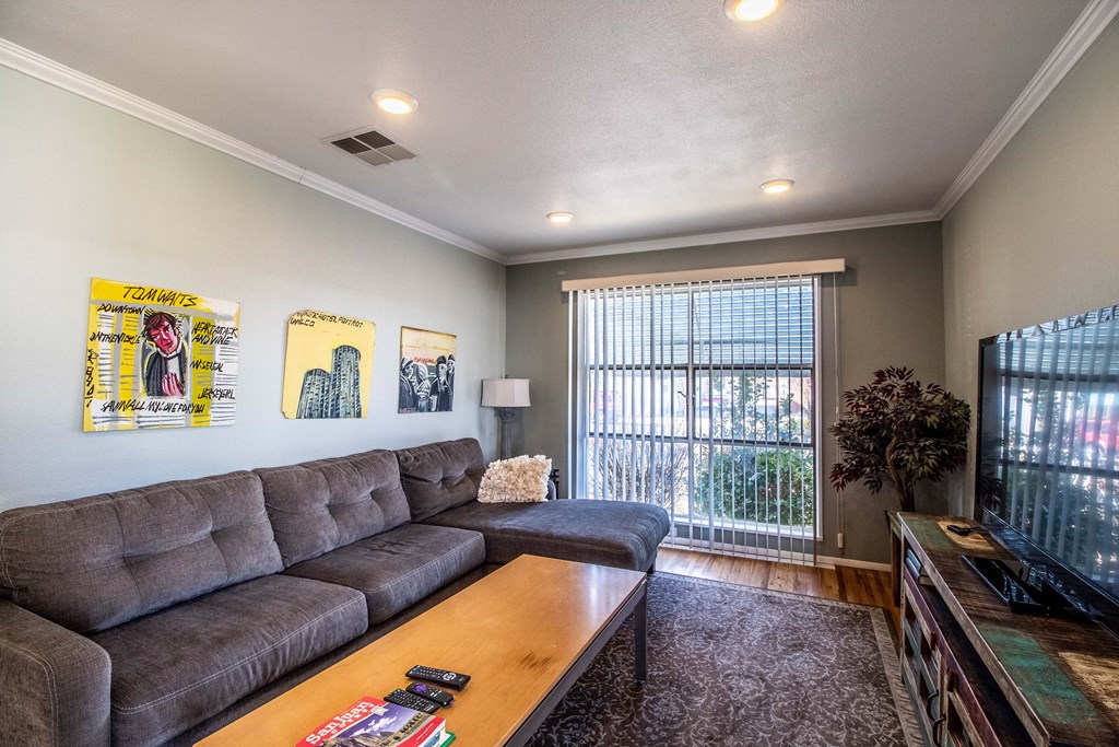 a living room with a couch and a tv
