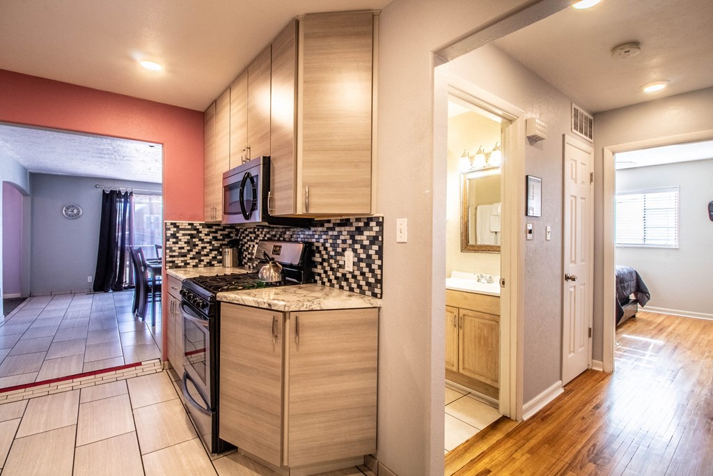 a kitchen with wooden cabinets and a counter top