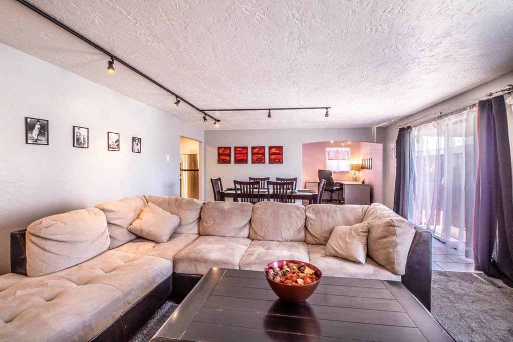 a living room with a large couch and a coffee table