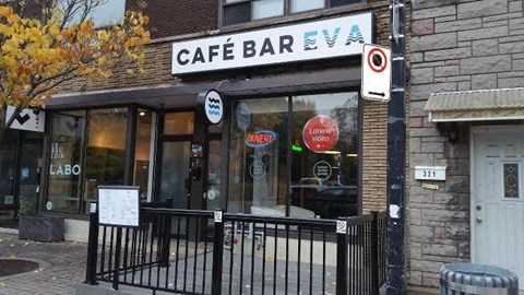a cafe bar on the side of a building