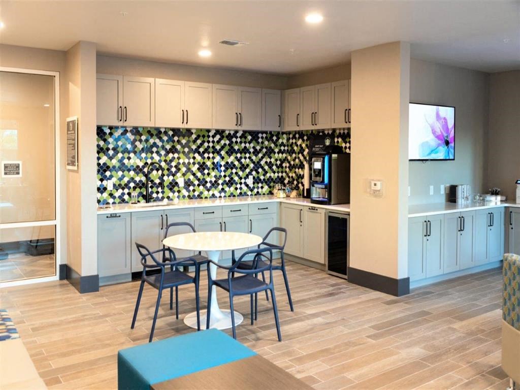 a break room with a table and chairs