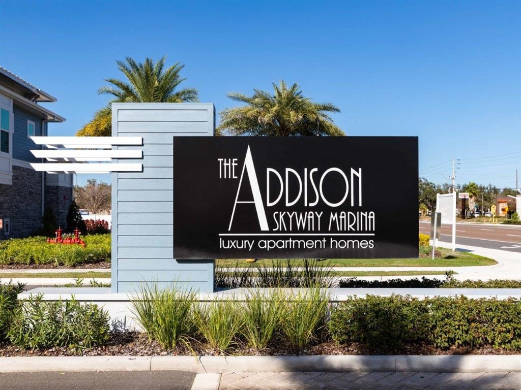 a sign for the addison skyway luxury apartment homes