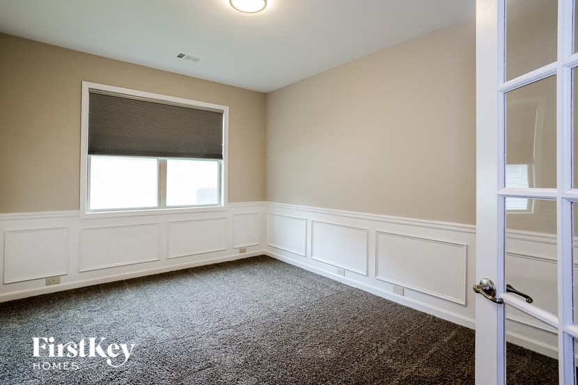 a empty room with white walls and a window