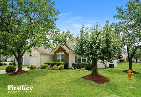 a house with trees in front of it