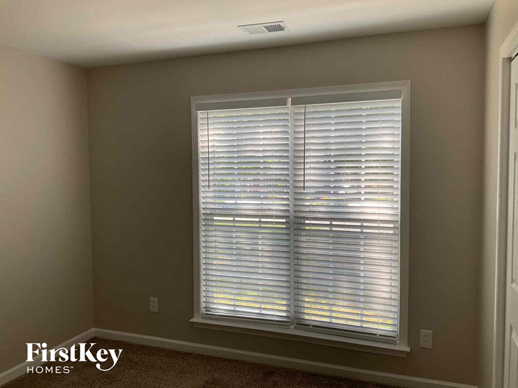 a window in a room with blinds on it