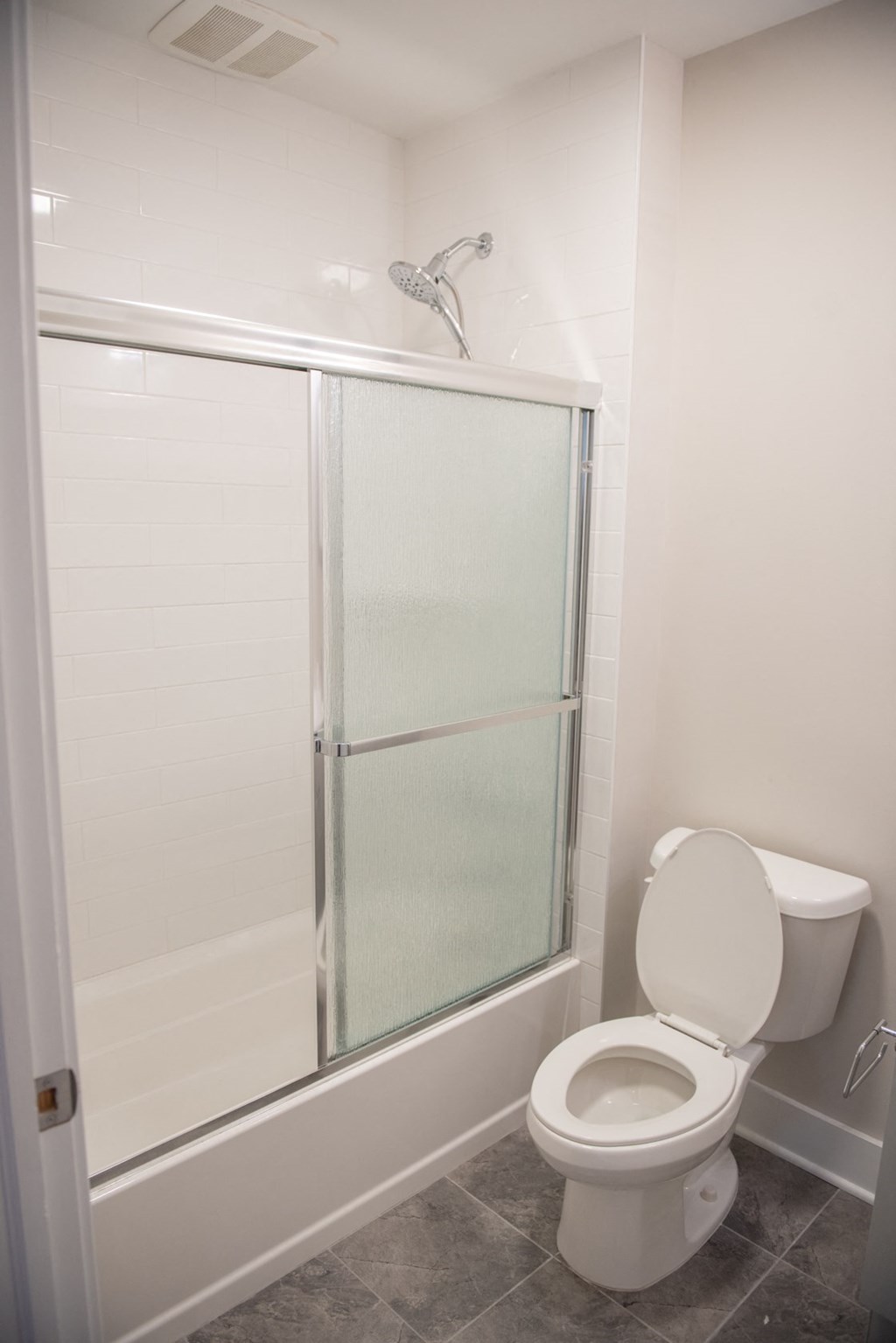 a small bathroom with a toilet and a shower