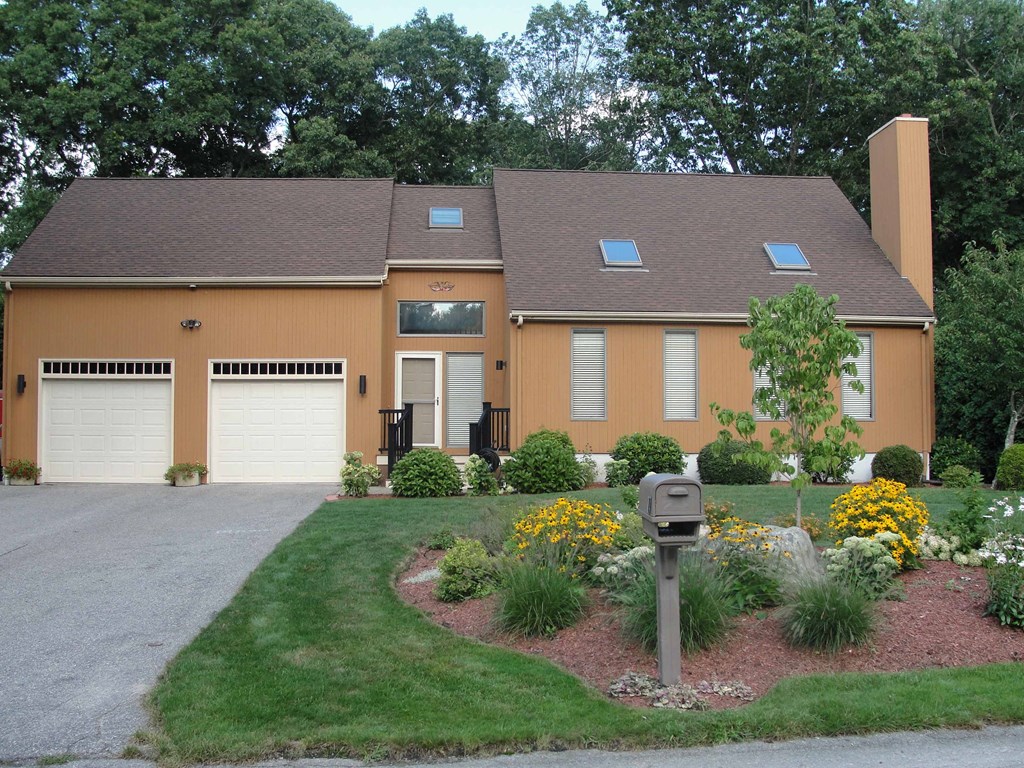 a house with a parking meter in front of it