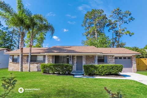 a house with a palm tree in front of it