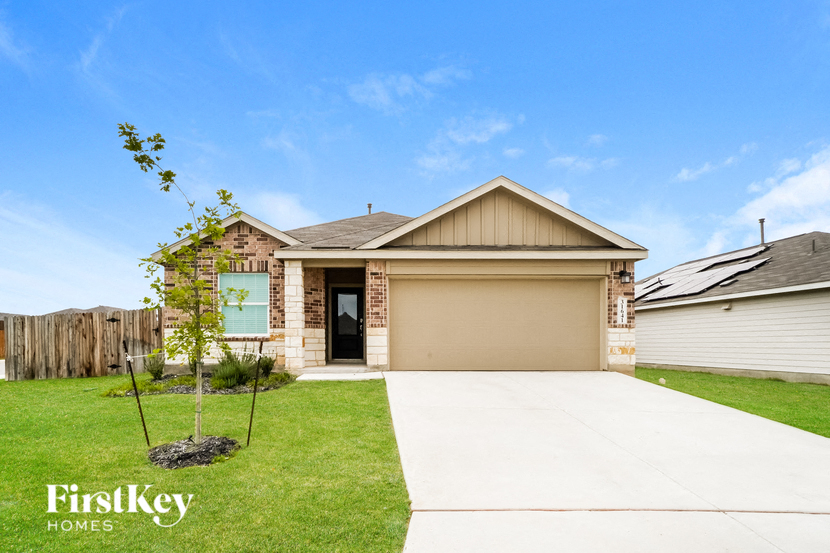 a home with a driveway and a garage door