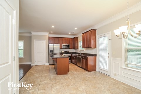 a kitchen with wooden cabinets and a counter top