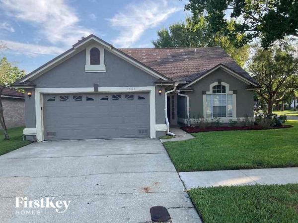 a house with a driveway and a garage door