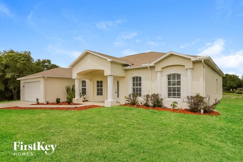 a house with a lawn in front of it
