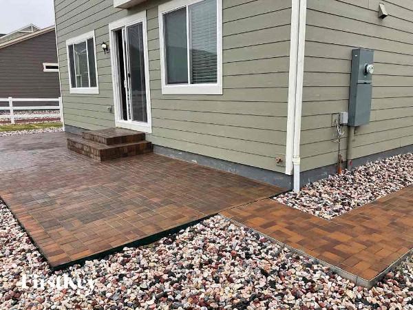 a front porch of a house with a brick walkway