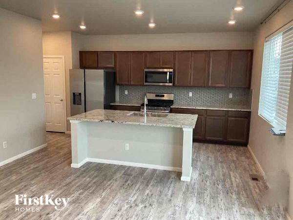 a kitchen with a counter top and a refrigerator