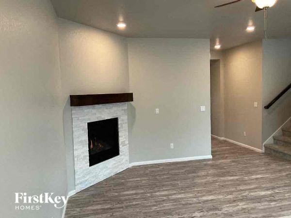 a empty living room with a fireplace