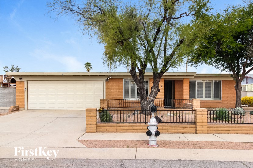 a house with a fire hydrant in front of it